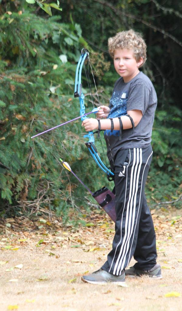 Oliver Ehlers plans his next shot.(Photo by Jim Waller/South Whidbey Record)