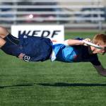 Conner Ryan dives for the disc at the World Junior Ultimate Championships held in Canada. Photo by Ulti Photos.