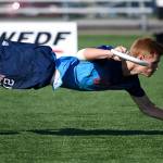 Conner Ryan dives for the disc at the World Junior Ultimate Championships held in Canada. Photo by Ulti Photos.