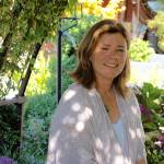 Photos by Joan Soltys                                <em>Maureen Murphy in the Laburnum Arbor, one of her favorite spots at Bayview Farm and Garden.</em>