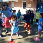 The class of Sarah Gillette plays a learning skills game outside on the south campus of South Whidbey Elementary during Tuesday mornings first day of school requiring them to talk about favorite things and quickly move to colored spots. A teachers strike was averted with a last-minute deal reached before midnight on Labor Day. (Photo by Patricia Guthrie/Whidbey News Group)