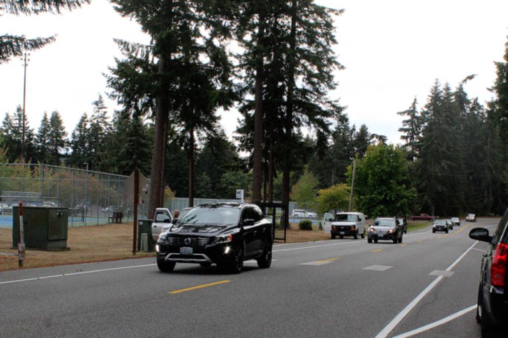 Vehicles stopping in the middle of the road to pick-up students, such as this car, are another reason to be cautious driving during school hours on Maxwelton Road.