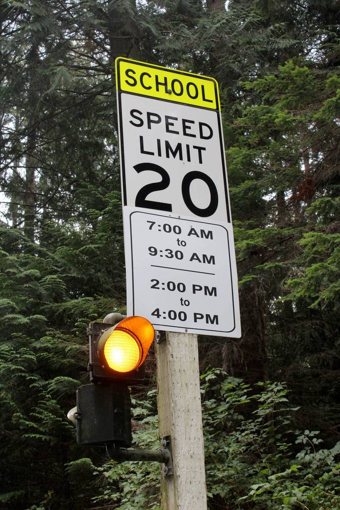 Flashing yellow lights and signs near South Whidbey elementary school campuses display when the 20 mph school zone is enforced; 7 to 9:30 a.m. and 2 to 4 p.m.