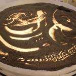 A prototype of Sand Dabber was shown at Wednesdays meeting. It consists of a layer of sand on glass lit up by LED lights underneath. Its a fun, inexpensive feature suggested for Seawall Park. (Photo by Patricia Guthrie/Whidbey News Group)