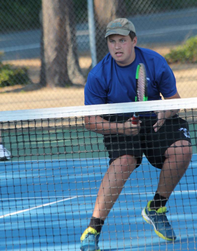 Ranger Buck puts on the brakes after firing a shot in third doubles.(Photo by Jim Waller/South Whidbey Record)