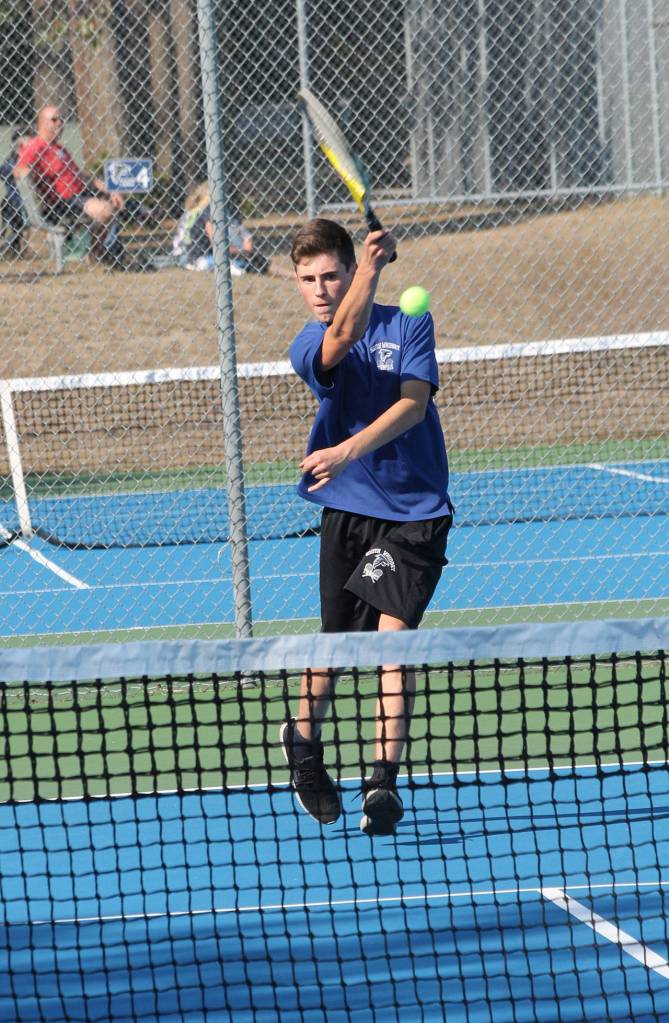 Soren Bratrude volleys against Coupeville.(Photo by Jim Waller/South Whidbey Record)