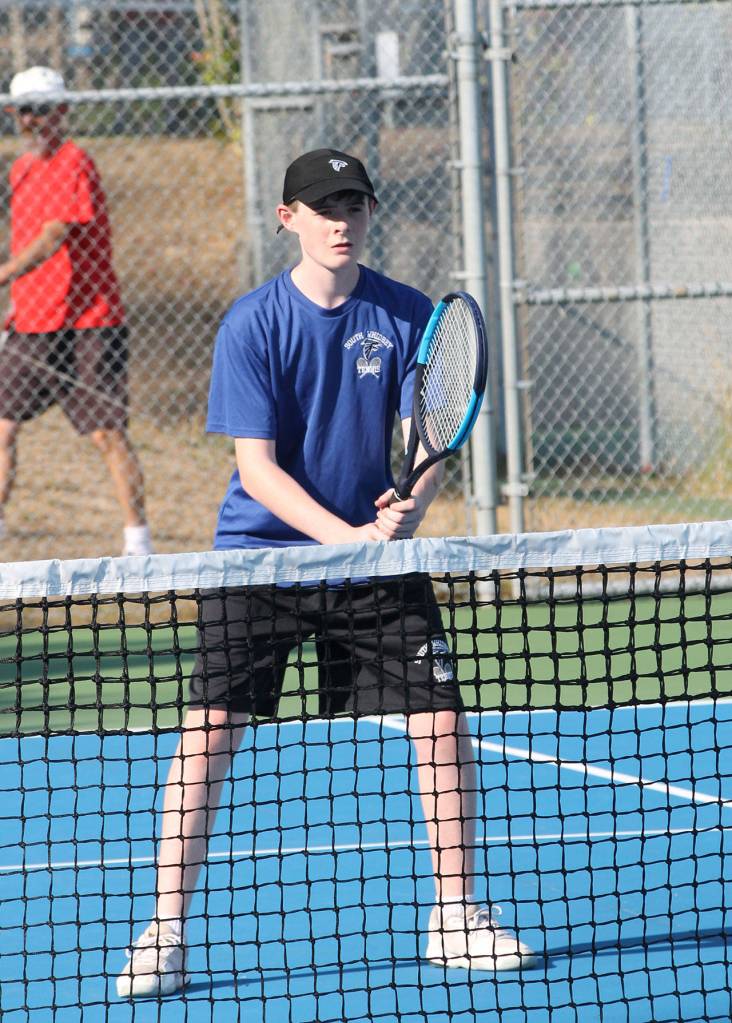 Ian Maddox prepares to receive a serve in second doubles.(Photo by Jim Waller/South Whidbey Record)