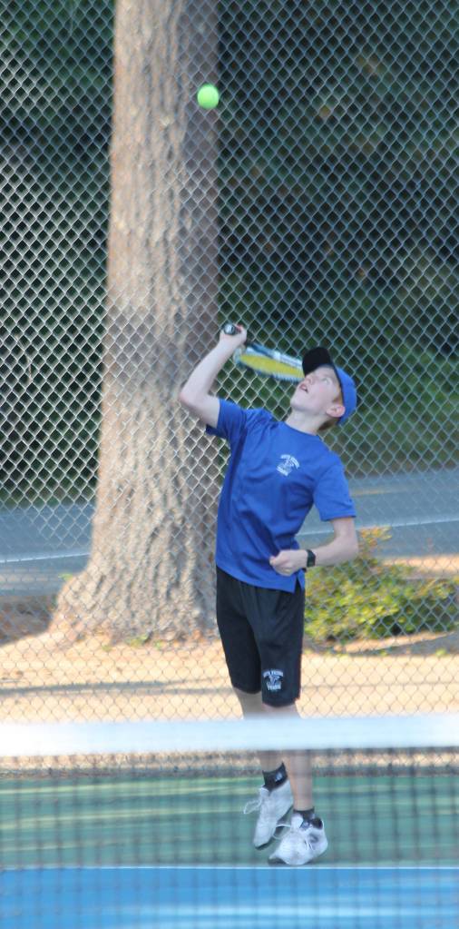 Max Rodriguez serves during the third doubles match.(Photo by Jim Waller/South Whidbey Record)