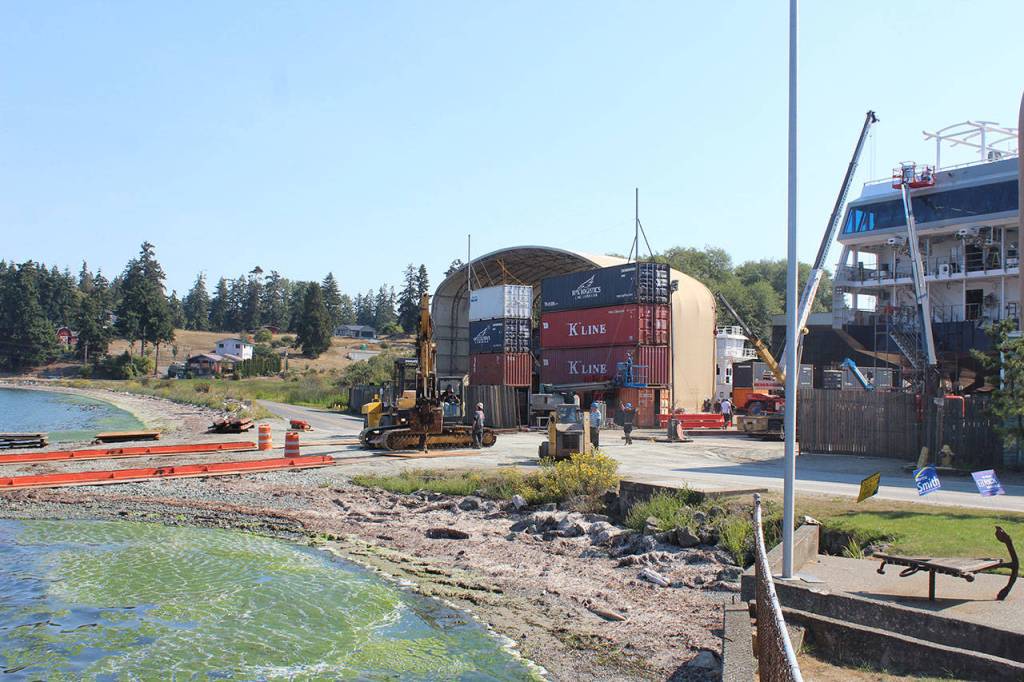 The 240-foot long ship will be slowly moved across Shoreline Drive towardHolmes Harbor using a slide system on two tracks that extend out into the water. Saturdays evening low tide provides an opportunity to get the ship to the waters edge and wait for the rising tide to float it off.