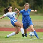 Juliana Larson fights through a Chimacum tackle. (Photo by John Fisken)