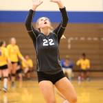 Chloe Johnson sets during South Whidbeys run through the invitational Saturday. (Photo by John Fisken)