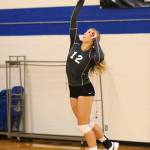 Emma Leggett serves for South Whidbey.(Photo by John Fisken)