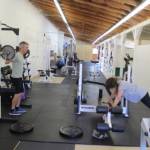 Vibrant Fitness has rented one of the fairgrounds building for four years. Owner Adam Fawcett (left) is a personal trainer who helps some 50 clients, including Emma Lloyd (right). (Photo by Patricia Guthrie/Whidbey News Group)