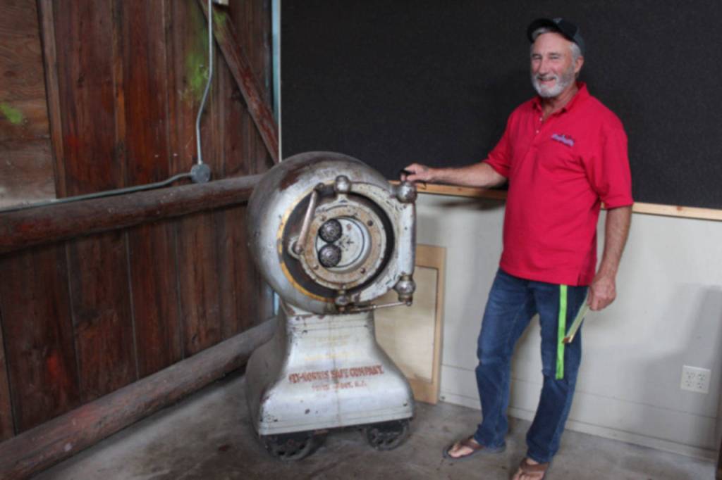Theres a few unusual fixtures found on the Island County Fairgrounds, such as this locked safe in the corner of the Pole Building. Larry Lehtonen, fairgrounds director, says no one knows whats in the safe or its combination. (Photo by Patricia Guthrie/Whidbey News Group)