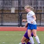 Maddy Drye advances the ball with a header. (Photo by John Fisken)