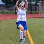 Mallory Drye tosses the ball back into play.(Photo by John Fisken)