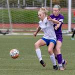 South Whidbeys Mikenna Wicher shields the ball from Oak Harbors Alexandra Palmer.(Photo by John Fisken)