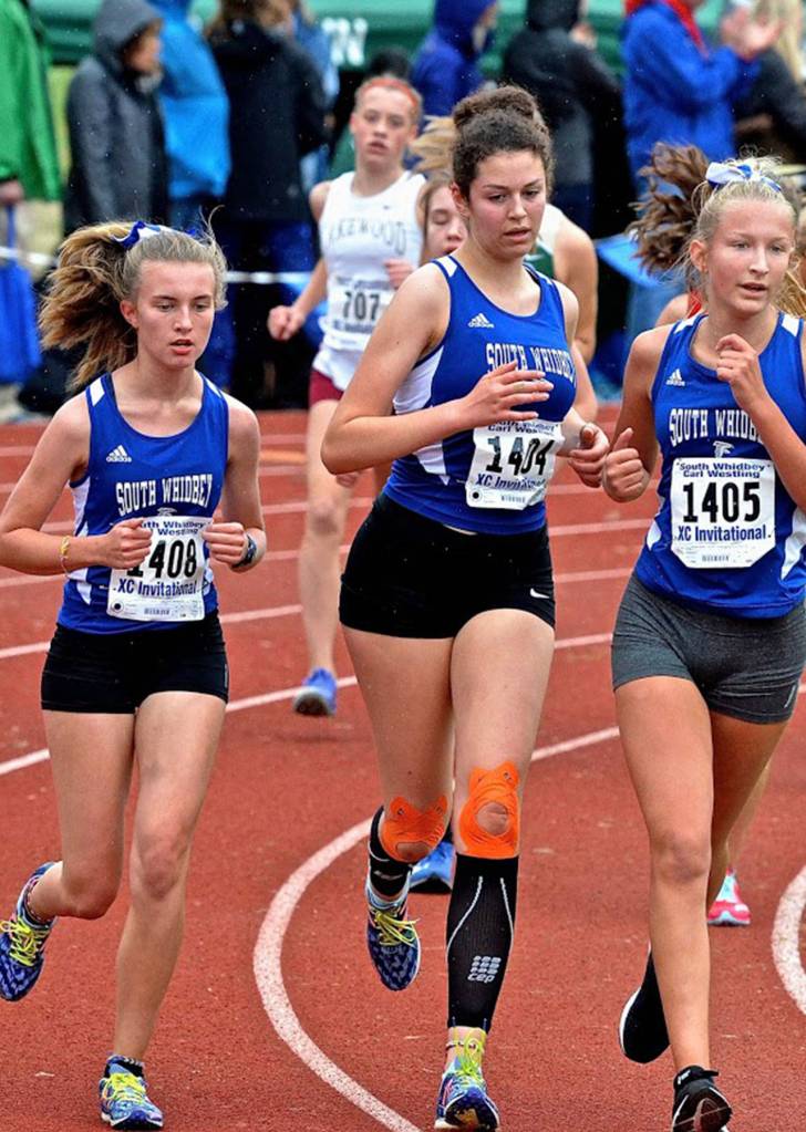 Natalie Rodriguez, left, Flannery Friedman and Laila Gmerek compete for the Falcons at the Westling Invitational.(Photo by Karen Swegler)