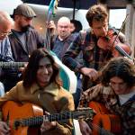 The Django djam in Djangley Saturday began with Luca Pino, ( left, front) from Long Beach, Calif. Many other musicians joined in as the sounds slipped through the rain in downtown Langley. (Photos by Patricia Guthrie/Whidbey News Group)