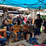 It began with two guitar players and one singer late Saturday afternoon in Langley during Djangofest Northwest 2018. An hour later, ten musicians were jamming on the patio of Double Bluff Brewey for soon-to-be bride, Jill Denkmann, far left, and her bachelorette party. Michael Doces, far right, is a singer who often visits his familys Freeland property.                                (Photo by Patricia Guthrie/Whidbey News Group)