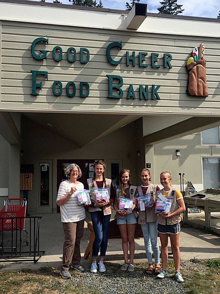 From left are food bank manager Karen Korbelik, Taryn Henny, Freja Heggenes, Abigail Ireland and Parker Forsyth.