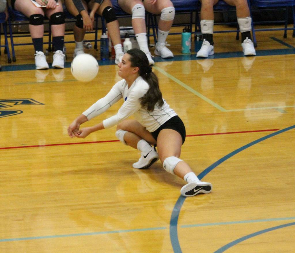 Angelina Wilson digs out a Coupeville serve.(Photo by Jim Waller/South Whidbey Record)