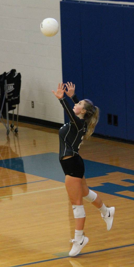 Chloe Johnson serves for the Falcons.(Photo by Jim Waller/South Whidbey Record)