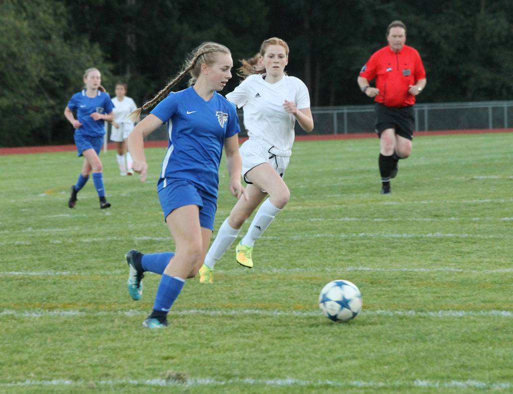 Samantha Ollis advances the ball for the Falcons.(Photo by Jim Waller/Whidbey News-Times)