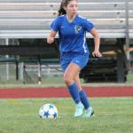 Kelly Mernane looks to an open teammate.(Photo by Jim Waller/Whidbey News-Times)