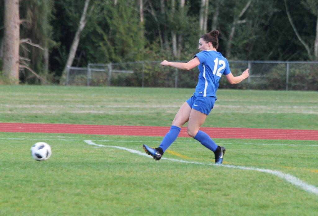 Karyna Hezel scores the first of her two goals against Cedar Park Christian. (Photo by Jim Waller/South Whidbey Record)
