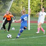 Mikenna Wicher punches in South Whidbeys first goal in a 5-0 win over Cedar Park Christian. (Photo by Jim Waller/South Whidbey Record)