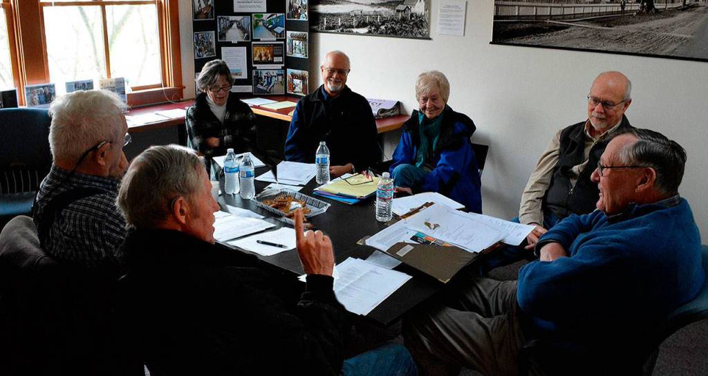 South Whidbey Historical Society volunteer board members include president Bill Haroldson, far right, Bruce Towne, Betty Discher, Bob Waterman, and Joan Handy. Seated on the other side are Tom Nack and Gary Gabelein. (Photo provided)