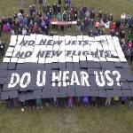 Photo courtesy of Sound Defense Alliance                                Nearly 200 people concerned about Growler jet noise participated in a card stunt outside the Crockett Barn Wednesday.