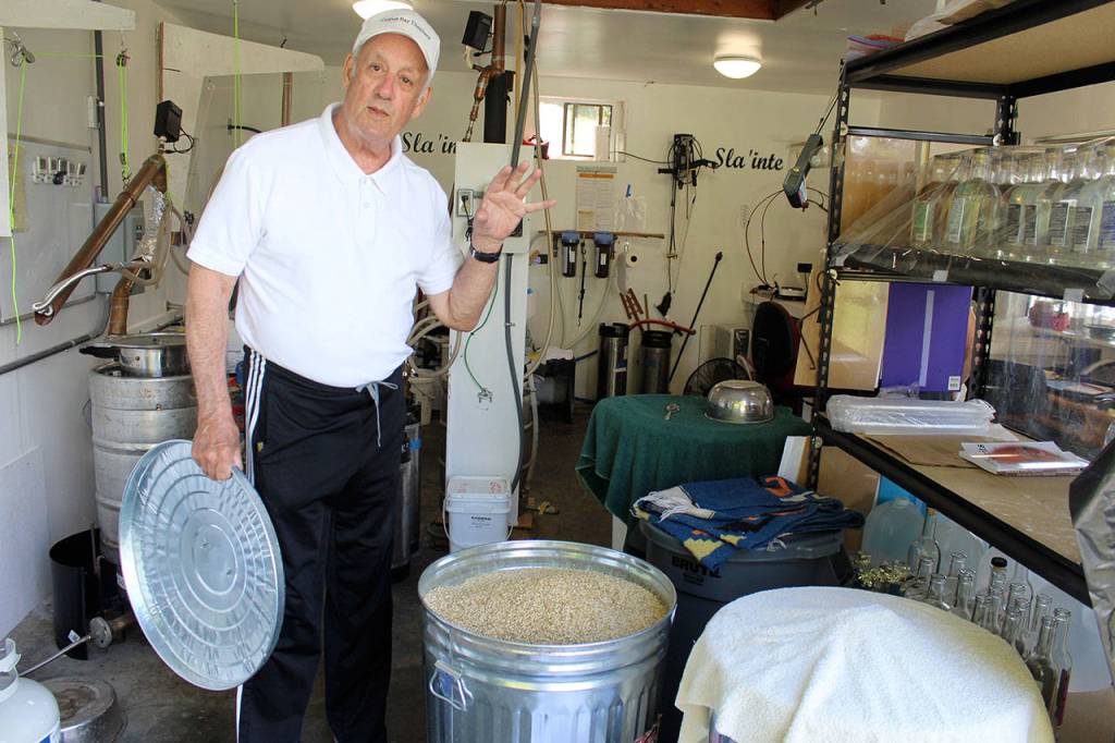 Harry Sloan shows the Skagit Valley barley used in making the spirits of Cultus Bay Distillery. Skagit Valley grows the best barley in the world, he said.