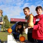 Gabe OBrien shows off his giant gourd picked Wednesday.