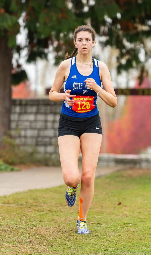 Flannery Friedman runs to ninth place, second among Falcon girls, Saturday.(Photo by John Fisken)