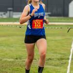 Grace Huffman finishes third for South Whidbey and 10th overall at the league meet.(Photo by John Fisken)