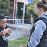 Lolly Titherington and KD Carpenter talk outside the Oak Harbor Fire Station where Titherington works. She helped make October Dwarfism Awareness and Acceptance Month in the state and she also works to educate people about dwarfism on the island. Photo by Laura Guido/Whidbey News-Times