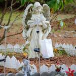 A luminary will light a memorial statue in the Langley Woodmen Cemetery on All Souls eve.