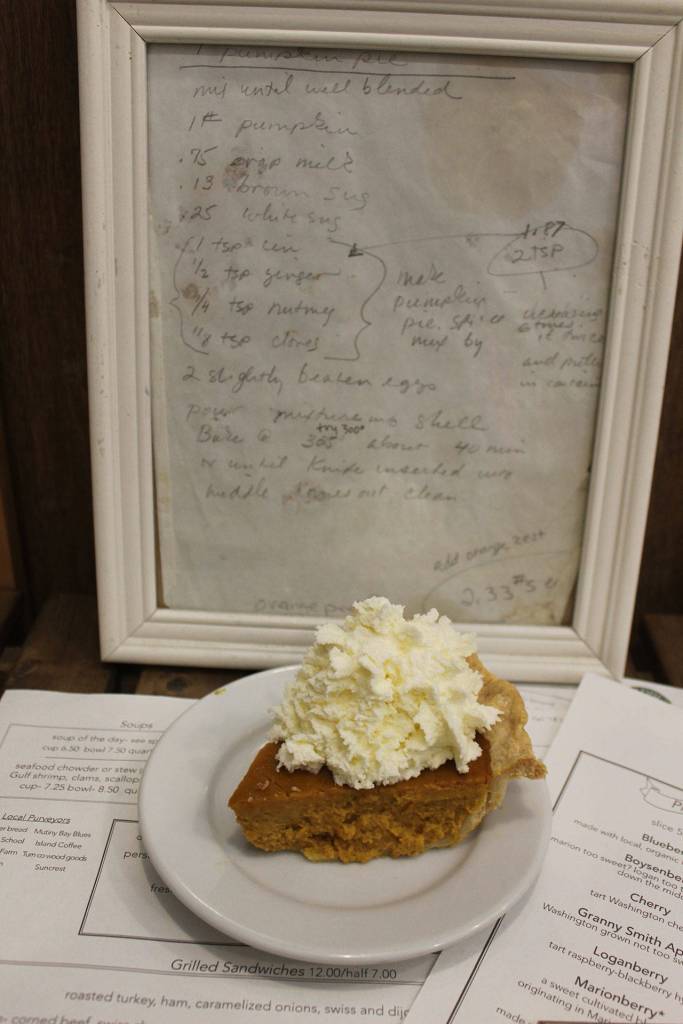 Whidbey Pies Cafe slice of pumpkin pie with the framed original pumpkin pie recipe.