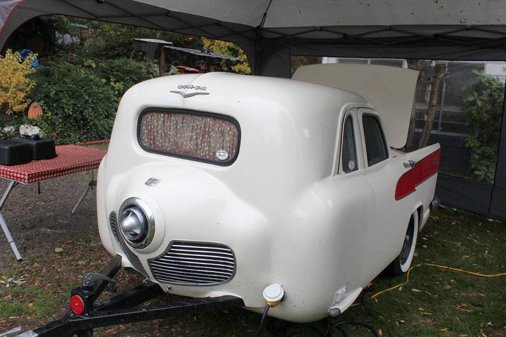 This camping trailer pulled behind a car sleeps two. Brian Woods of British Columbia built it from 11 cars, four trucks and two motorcycles. A kitchen fits in the trunk and a side door opens to the bed. The Studebaker front led it to being dubbed Miss Piggy.