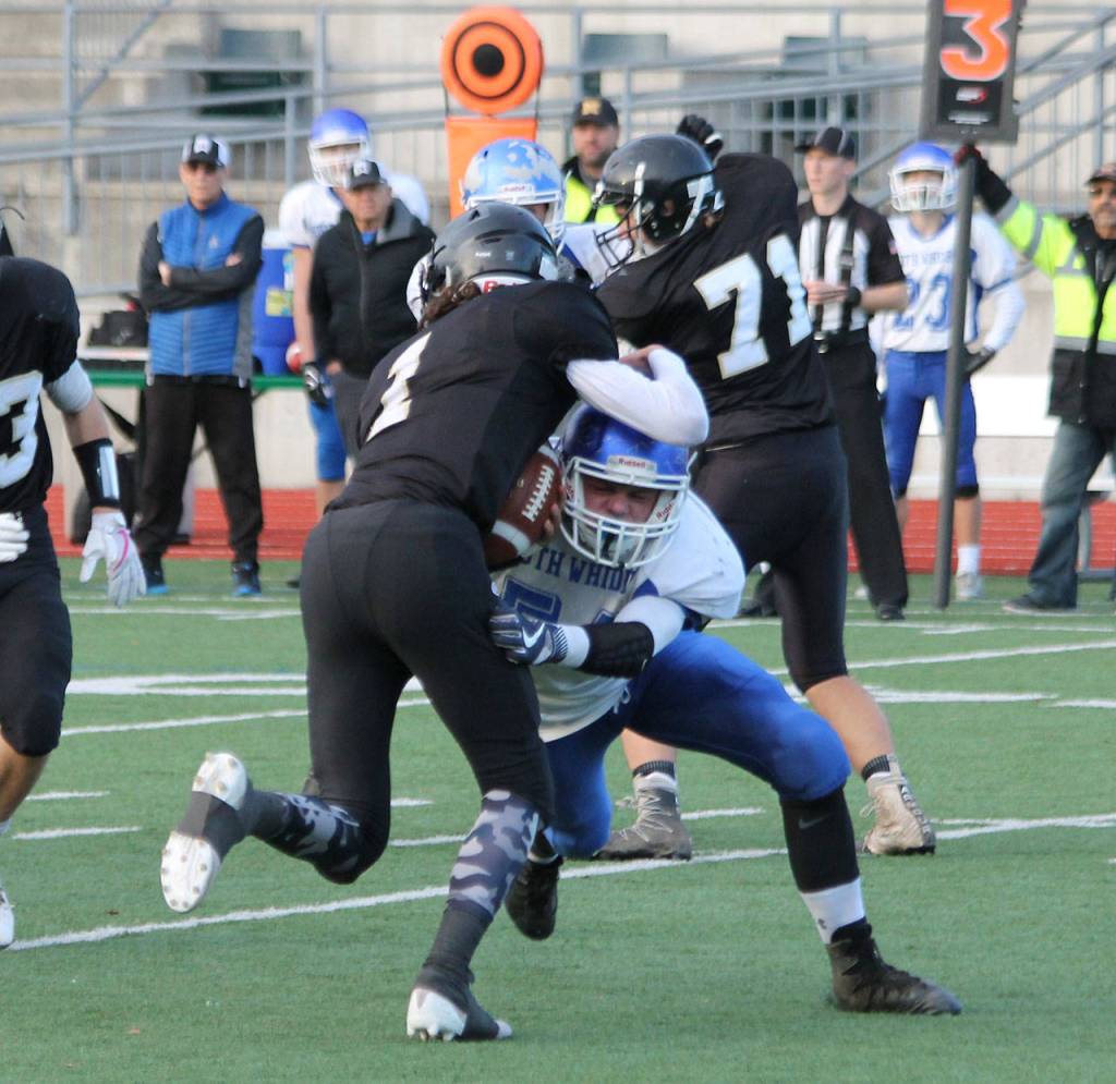 Wyatt De Mers brings down Meridian quarterback Dawson Logan (1).(Photo by Jim Waller/South Whidbey Record)