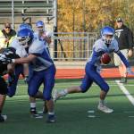 Falcon quarterback Kody Newman fakes a handoff to Caden Spear on a play-action pass.(Photo by Jim Waller/South Whidbey Record)