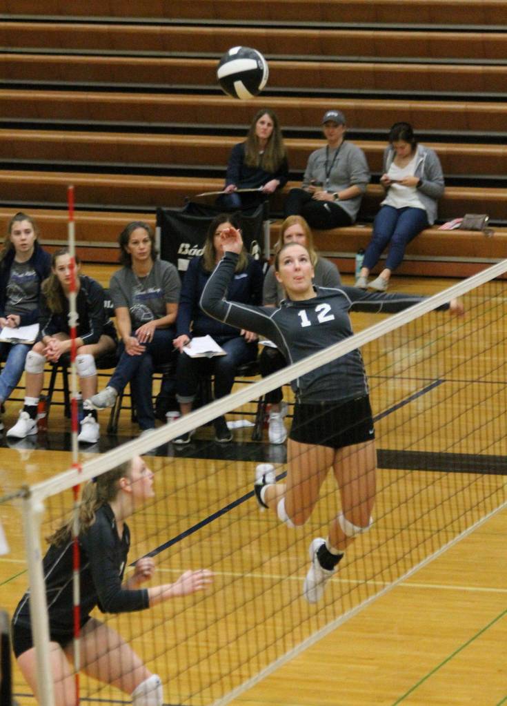Emma Leggetts leaps for a kill attempt.(Photo by Jim Waller/South Whidbey Record)