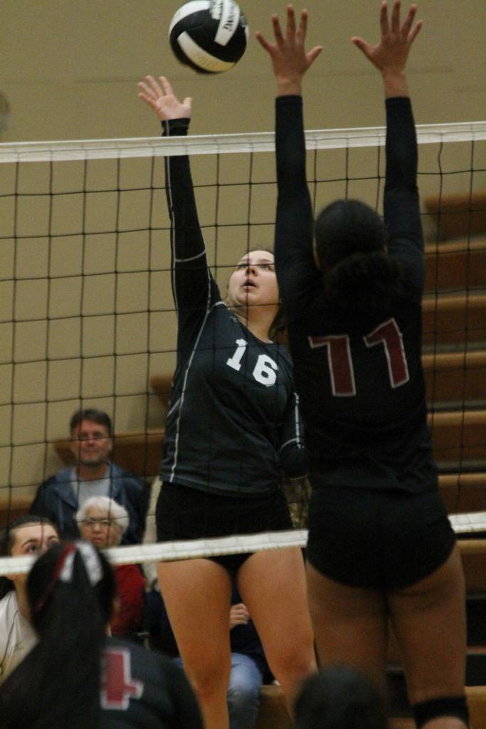 Megan Leonard hits by the block of Northwests Melat Feseha.(Photo by Jim Waller/South Whidbey Record)