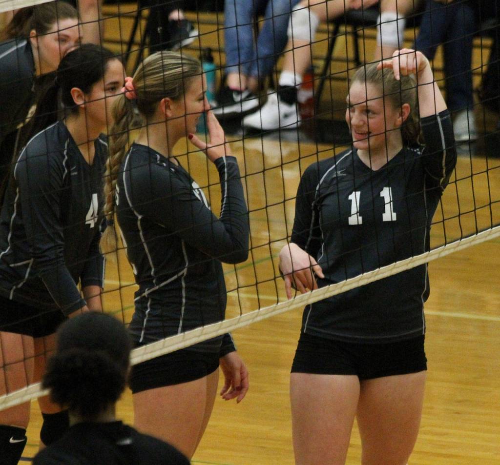 Emma Hodson (11) and Emma Leggett (center) joke about Leggetts previous hit.(Photo by Jim Waller/South Whidbey Record)
