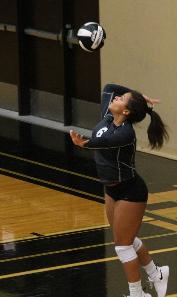 Maya Tschetter launches a serve for the Falcons.(Photo by Jim Waller/South Whidbey Record)