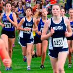 South Whidbeys Flannery Friedman, left; Laila Gmerek, center; and Natalie Rodriguez, right; navigate through the mass of runners. (Photo by Karen Swegler)