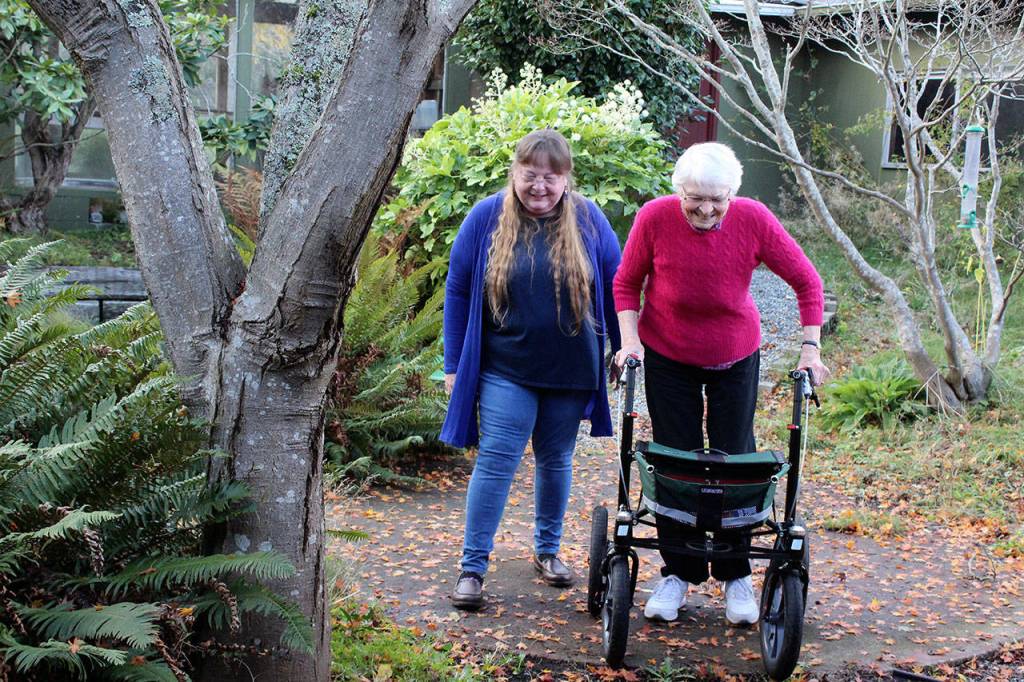 Kat Ersch, left, regularly helps Erma Aldous by driving her to appointments and veterans meetings. Ersch, the widow of a Navy veteran, is a volunteer advocate who helps veterans find out about benefits and services. (Photo by Patricia Guthrie/Whidbey News Group)