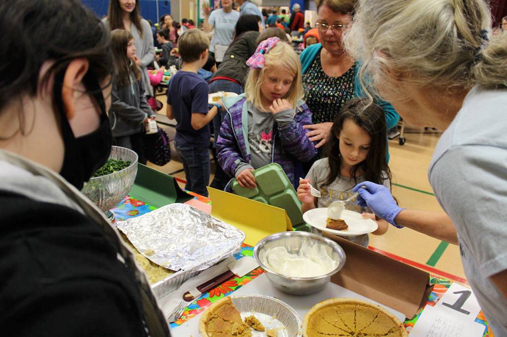 For the first time, side dishes were made by a team of students who spent nine weeks harvesting, preparing and learning to cook and bake. They mashed about 75 pounds of potatoes, made kale salad and baked 80 pumpkin pies, all harvested from the school backyard garden.